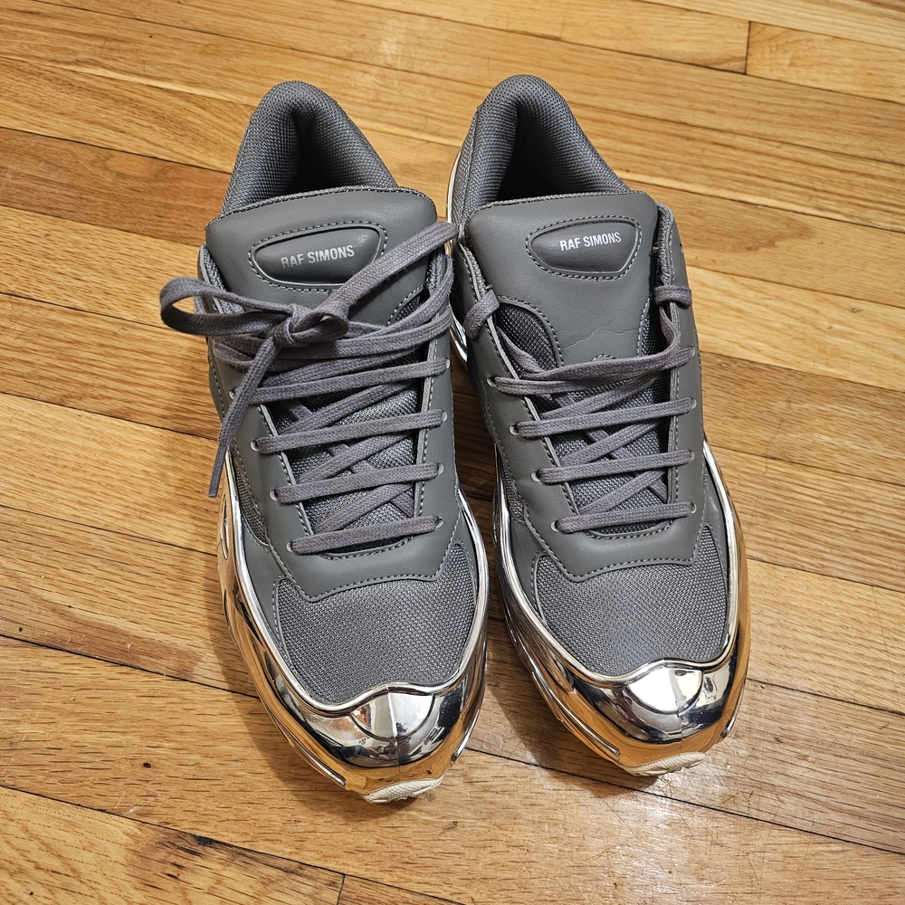 Raf Simons Adidas Ozweego Chrome Ash and Silver Sneakers.